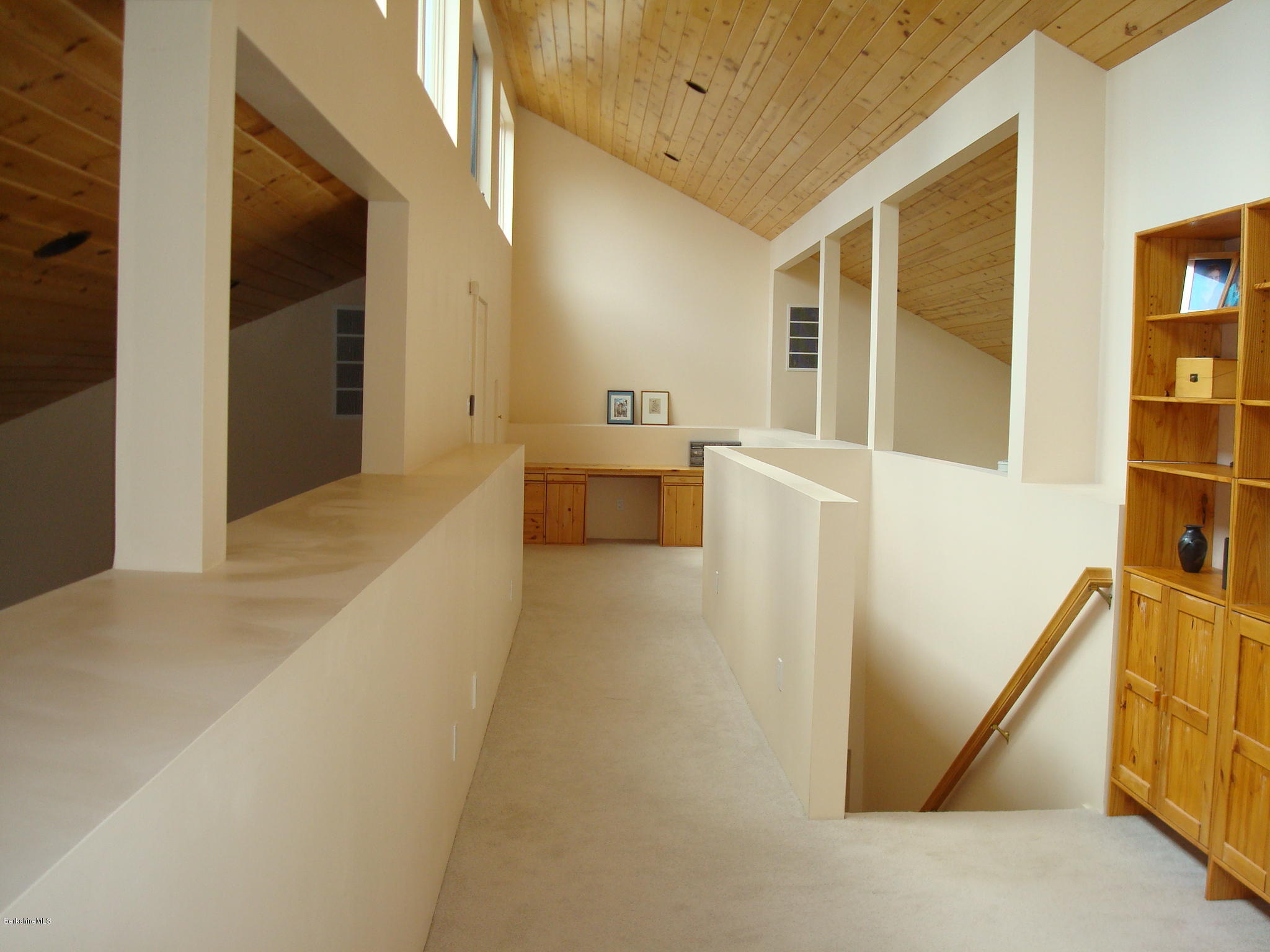 1151 E Road Richmond, MA 01254 - Photo 23 of 33 a view of a hallway with wooden floor and furniture