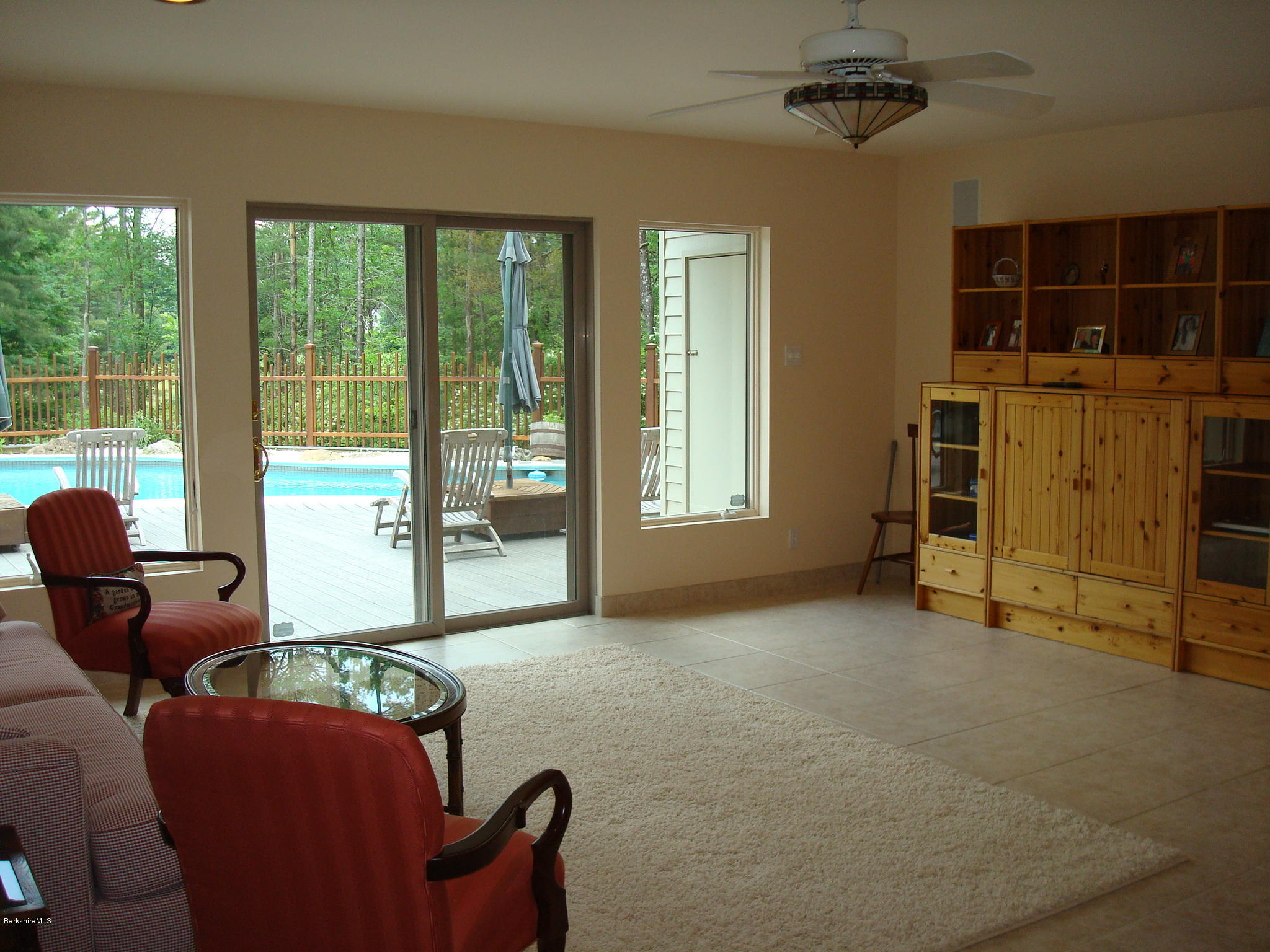 1151 E Road Richmond, MA 01254 - Photo 26 of 33 a living room with furniture and a floor to ceiling window