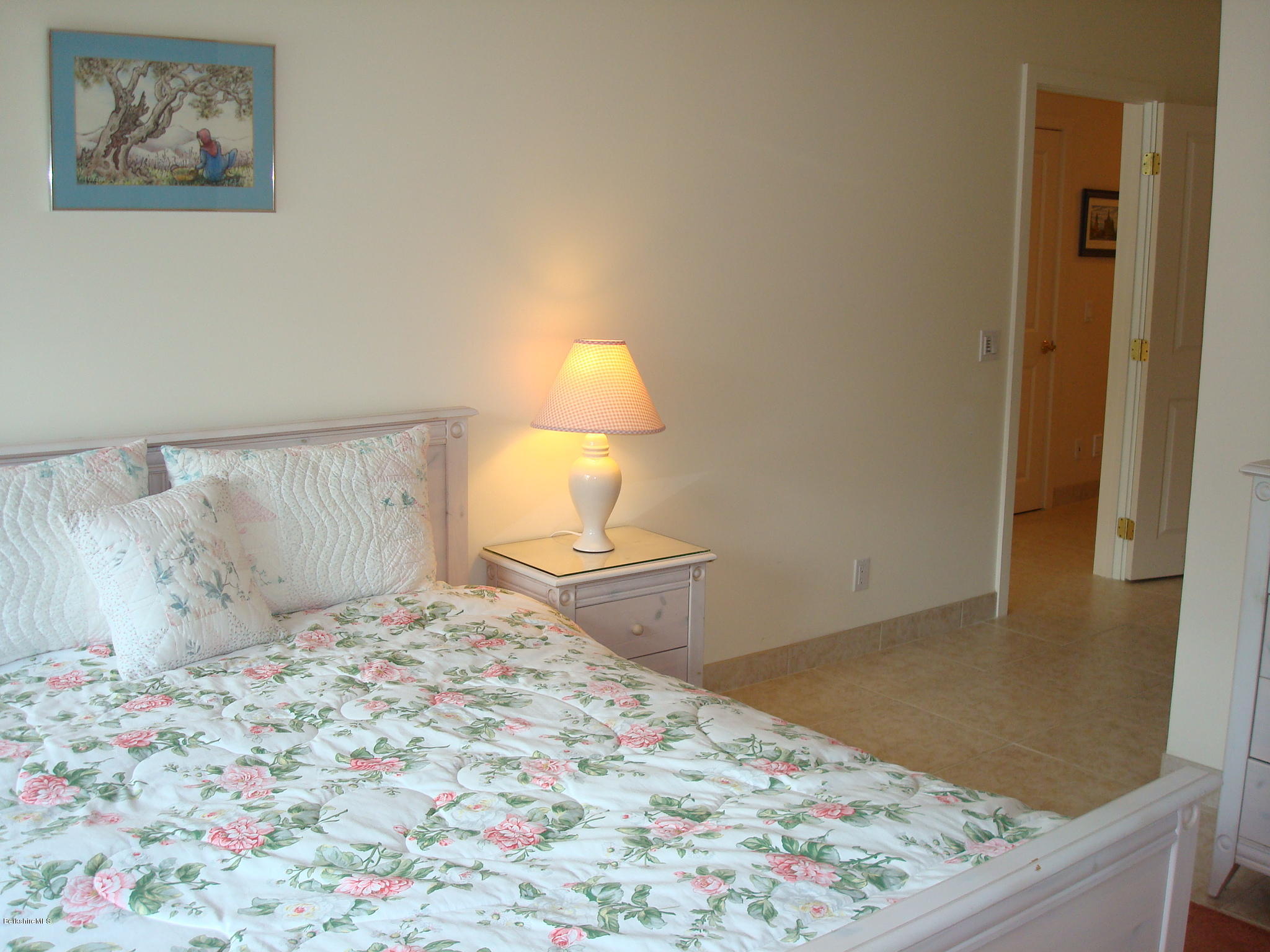 1151 E Road Richmond, MA 01254 - Photo 29 of 33 a bedroom with a bed and a painting on the wall