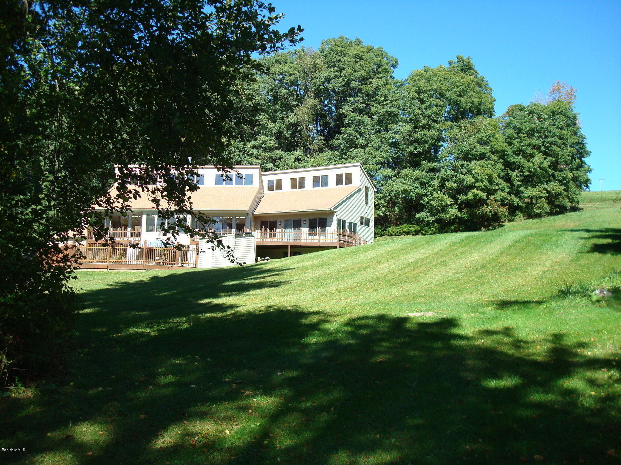 1151 E Road Richmond, MA 01254 - Photo 4 of 33 a view of a house with a big yard
