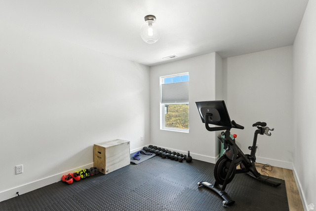 6039 North Westridge Road Heber City, UT 84032 - Photo 13 of 22 Versatile room featuring a single window with a roller shade, white walls, and a ceiling-mounted light fixture
