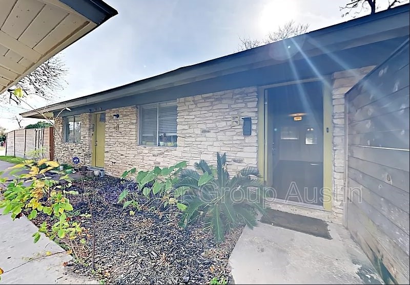 6115 Manor Road, Unit B Austin, TX 78723 - Photo 1 of 1 a backyard of a house with outdoor seating