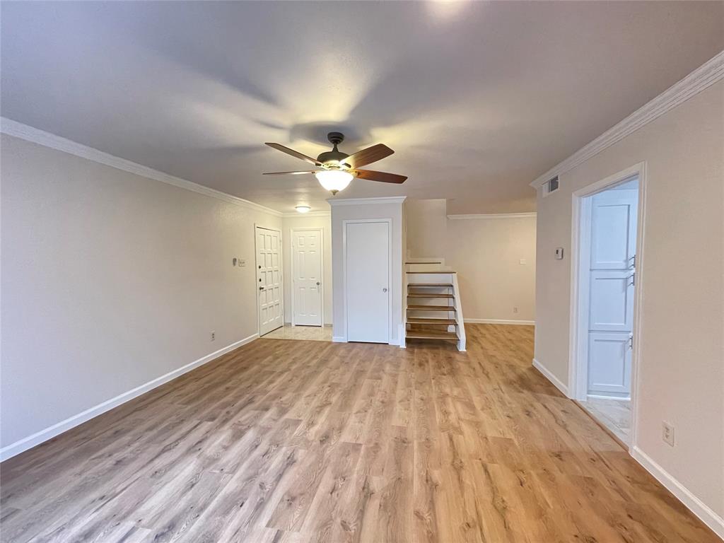 336 Melrose Drive, Unit 5C Richardson, TX 75080 - Photo 7 of 22 a view of an empty room with wooden floor