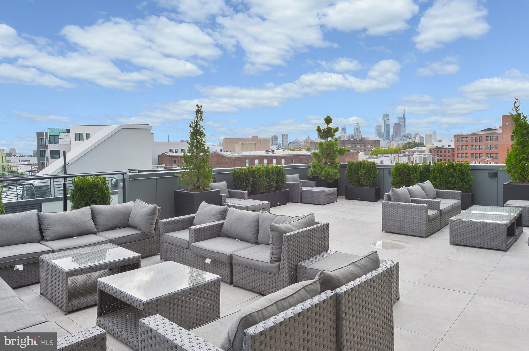 236 West Thompson Street, Unit B401 Philadelphia, PA 19122 - Photo 19 of 48 a view of a patio with couches and a potted plant
