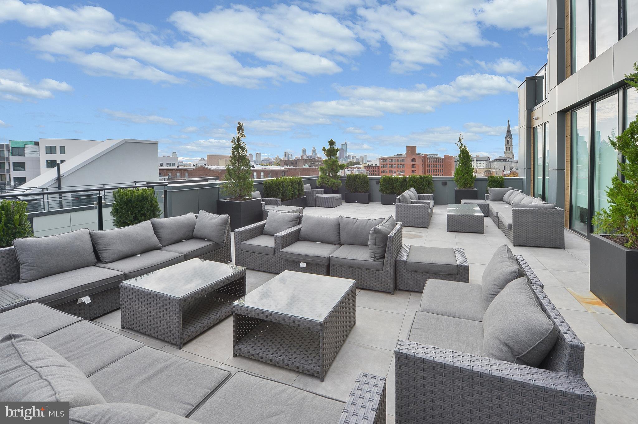 236 West Thompson Street, Unit B401 Philadelphia, PA 19122 - Photo 20 of 48 a terrace with couches and a coffee table