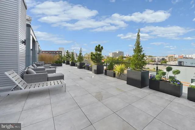 a view of a terrace with furniture