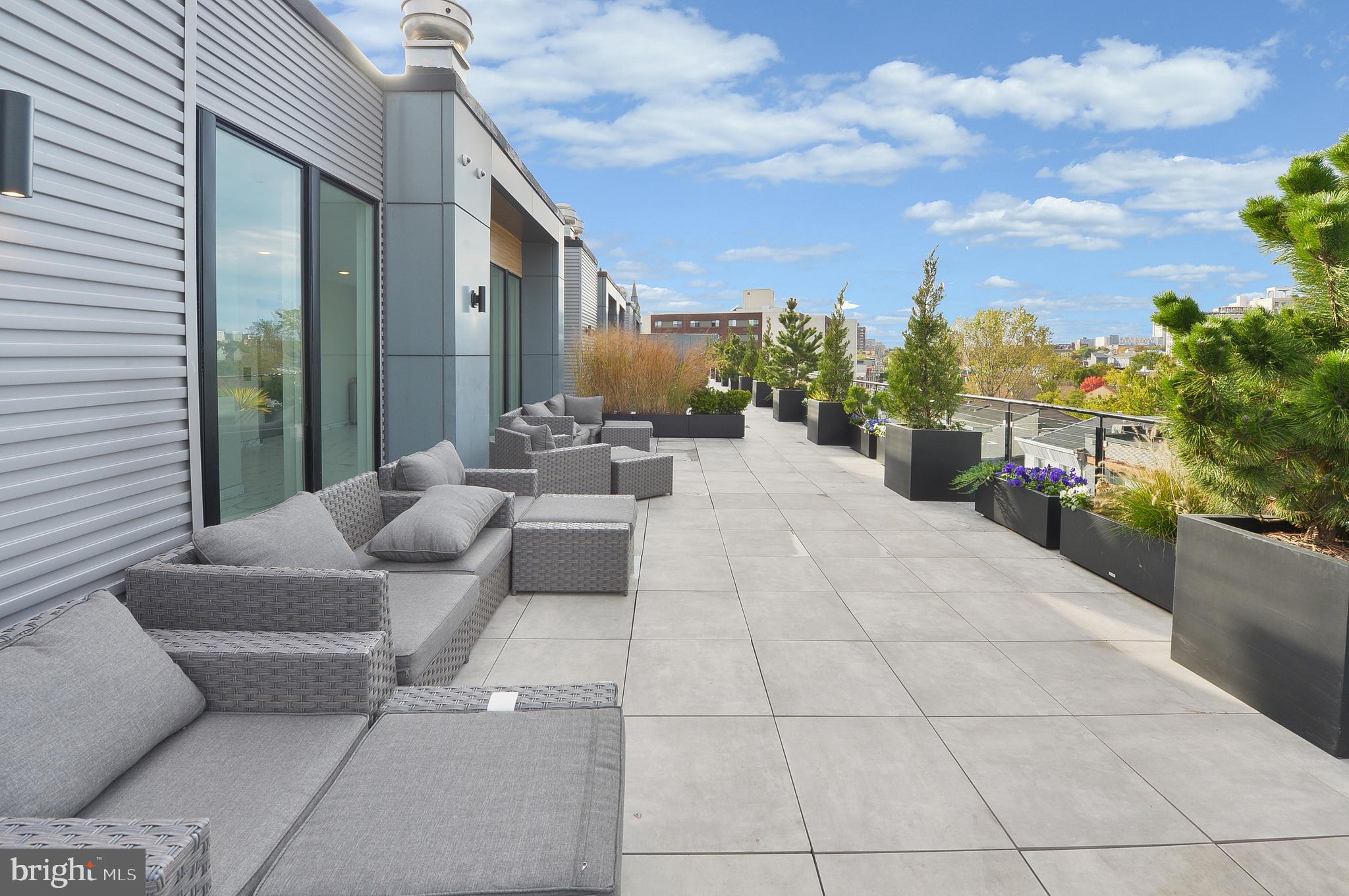 236 West Thompson Street, Unit B401 Philadelphia, PA 19122 - Photo 41 of 48 a building outdoor space with patio furniture and a potted plant