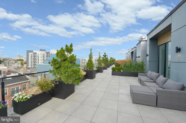 a lobby with furniture and flowers