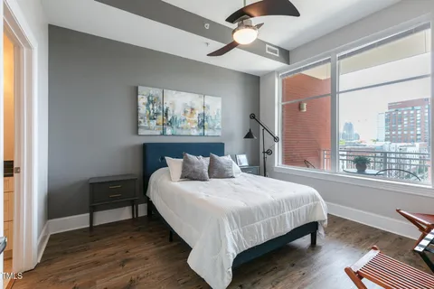 a kitchen with granite countertop a sink cabinets and stainless steel appliances