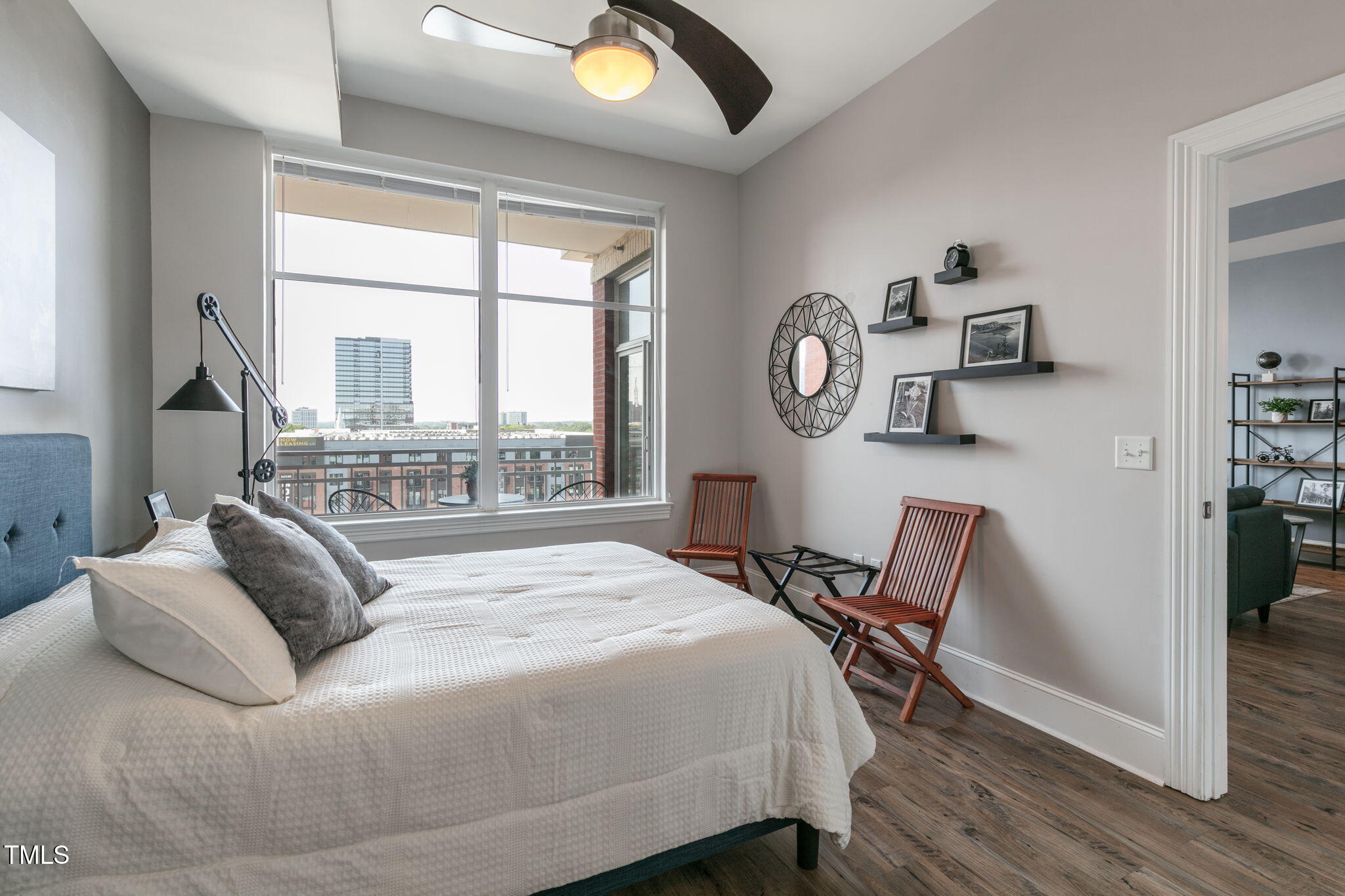 400 West North Street, Unit 1134 Raleigh, NC 27603 - Photo 14 of 39 a bedroom with a bed and a large window