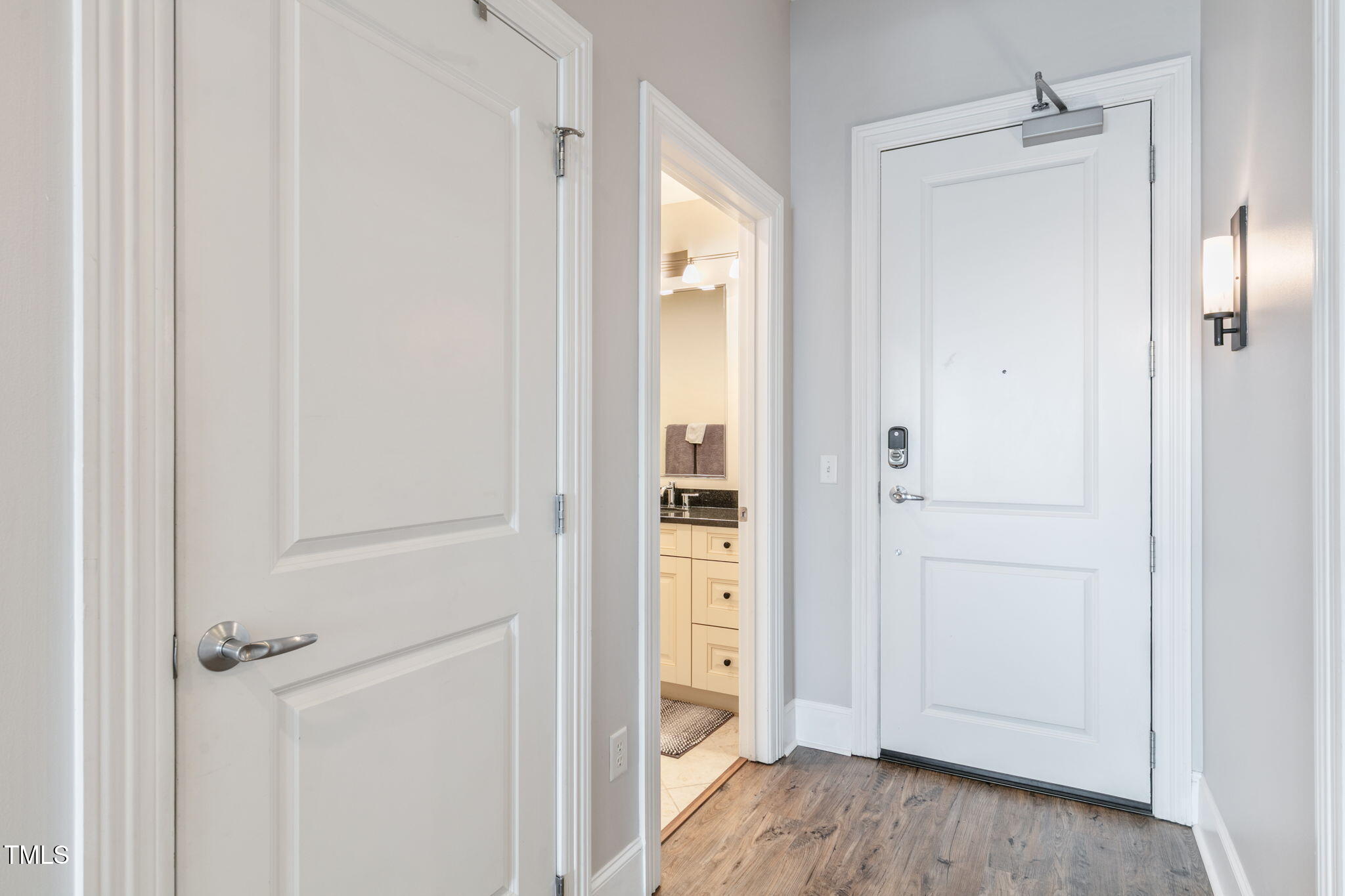 400 West North Street, Unit 1134 Raleigh, NC 27603 - Photo 18 of 39 a view of a bathroom with a sink and mirror
