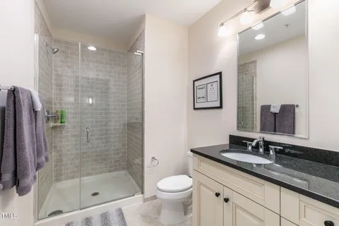 a view of a bathroom with a sink and mirror