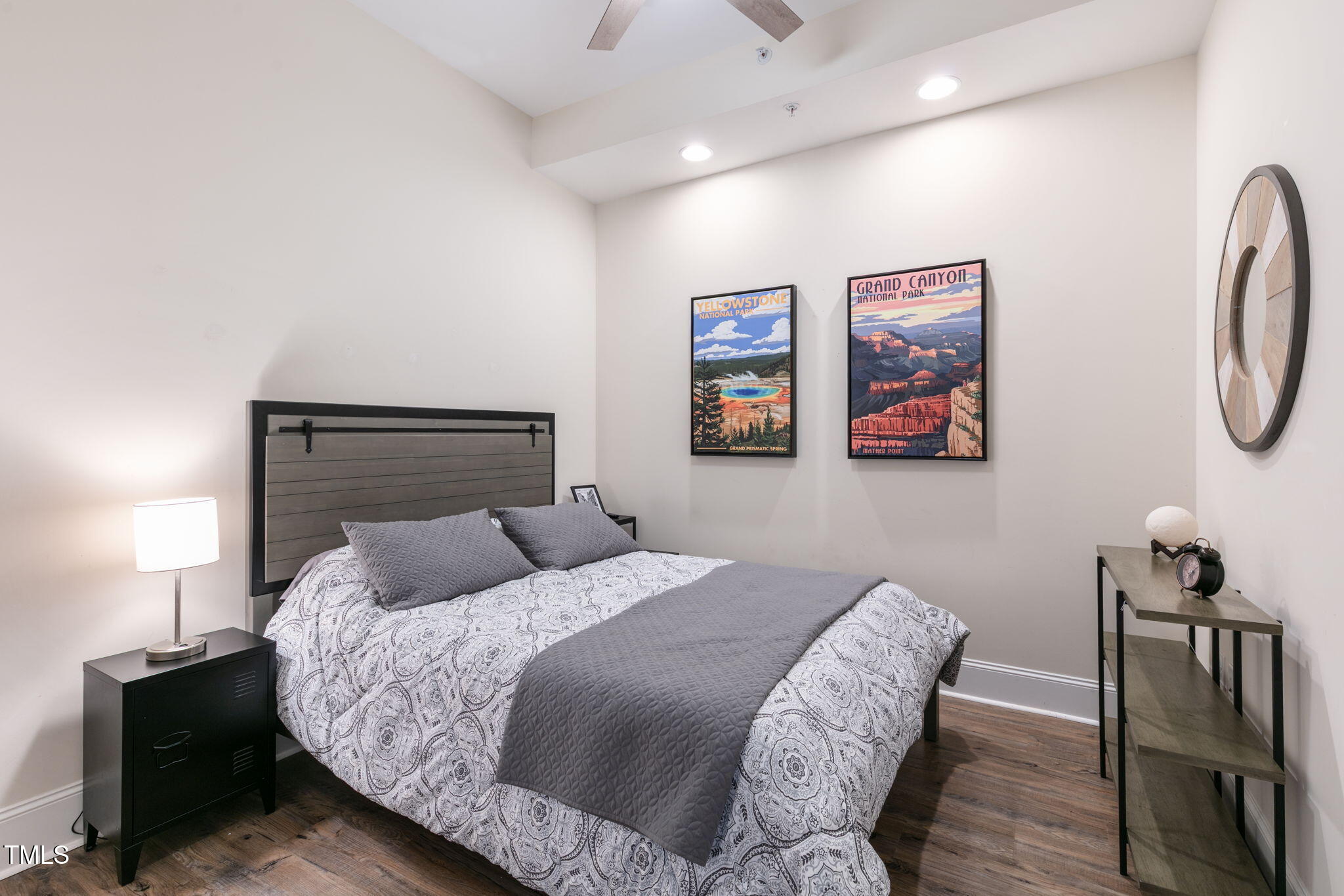400 West North Street, Unit 1134 Raleigh, NC 27603 - Photo 20 of 39 a bedroom with a bed and wooden floor