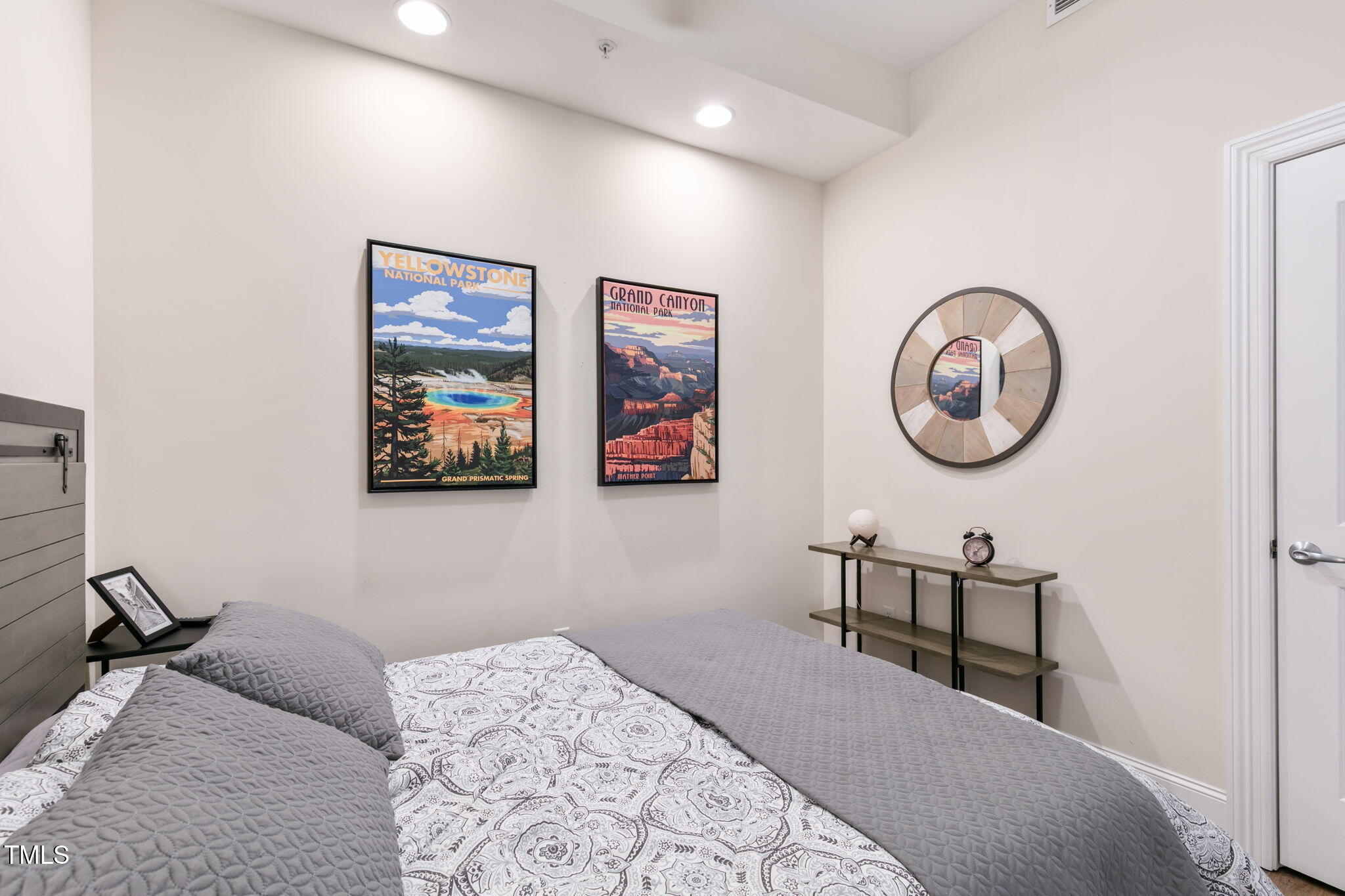 400 West North Street, Unit 1134 Raleigh, NC 27603 - Photo 21 of 39 a bedroom with a bed and a chandelier