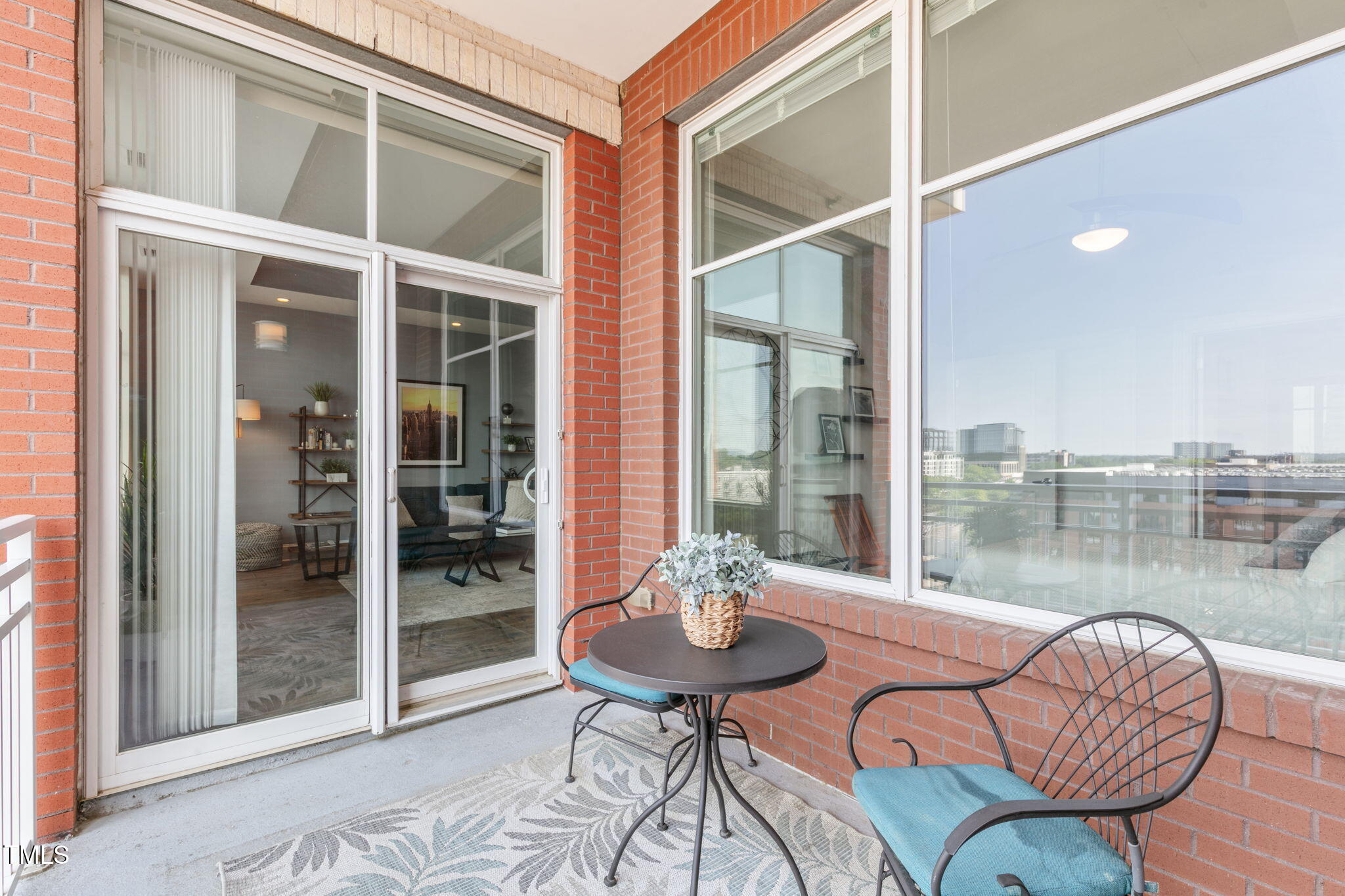 400 West North Street, Unit 1134 Raleigh, NC 27603 - Photo 24 of 39 a living room with furniture and a floor to ceiling window