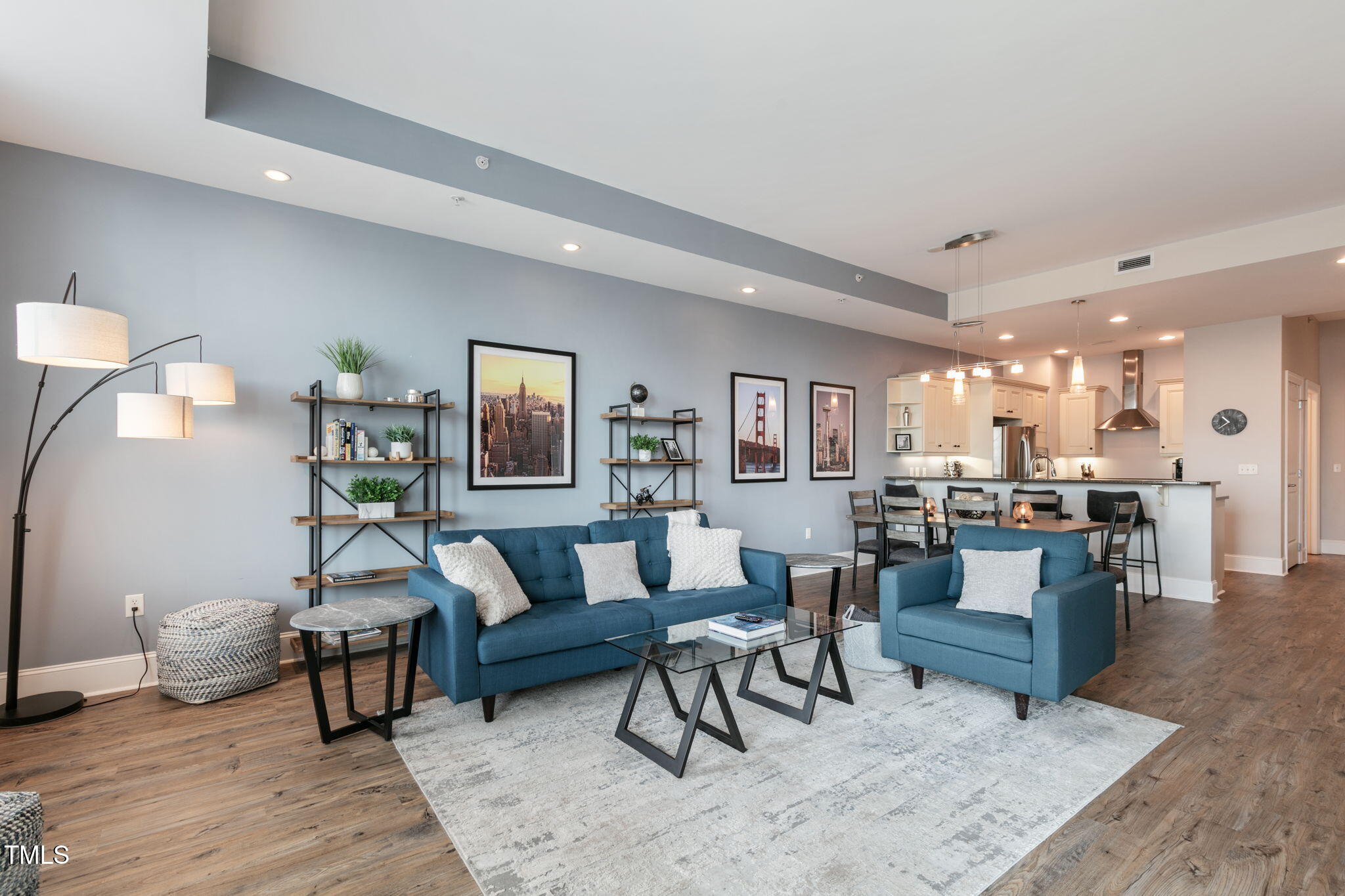 400 West North Street, Unit 1134 Raleigh, NC 27603 - Photo 5 of 39 a living room with furniture and a wooden floor