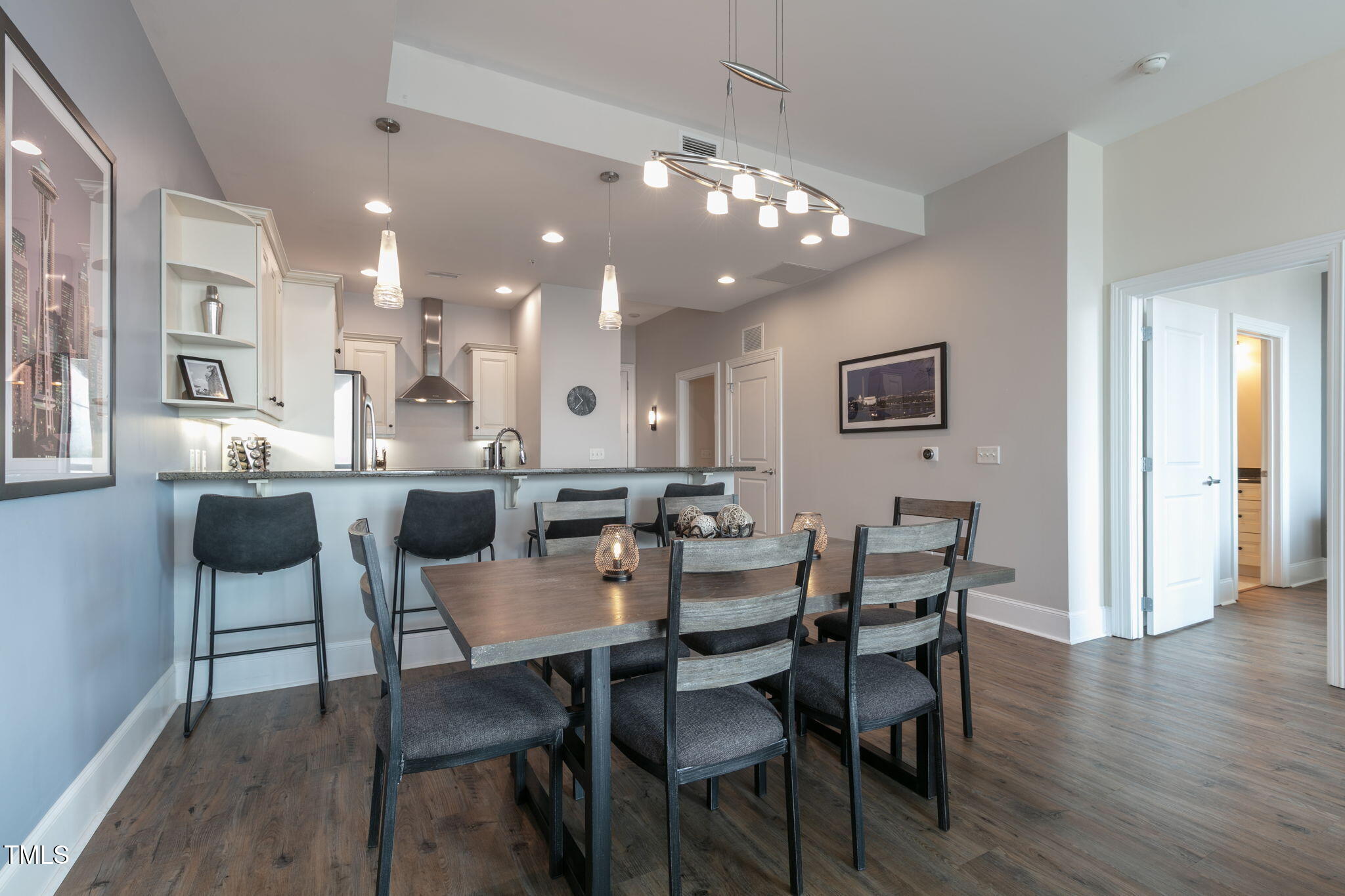 400 West North Street, Unit 1134 Raleigh, NC 27603 - Photo 8 of 39 a view of a dining room with furniture and wooden floor