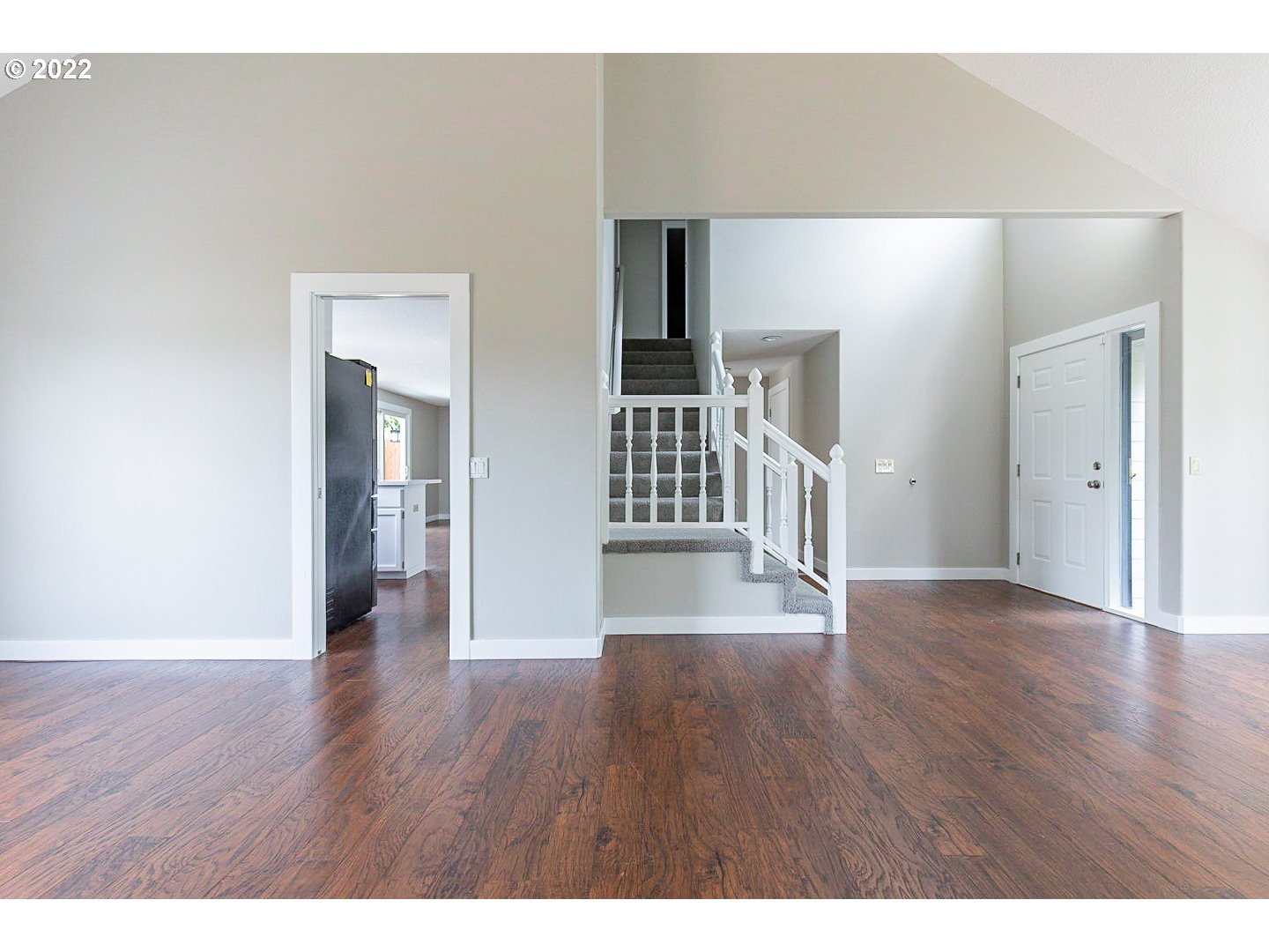 7354 Southwest 166th Terrace Beaverton, OR 97007 - Photo 13 of 32 a view of a hallway with wooden floor