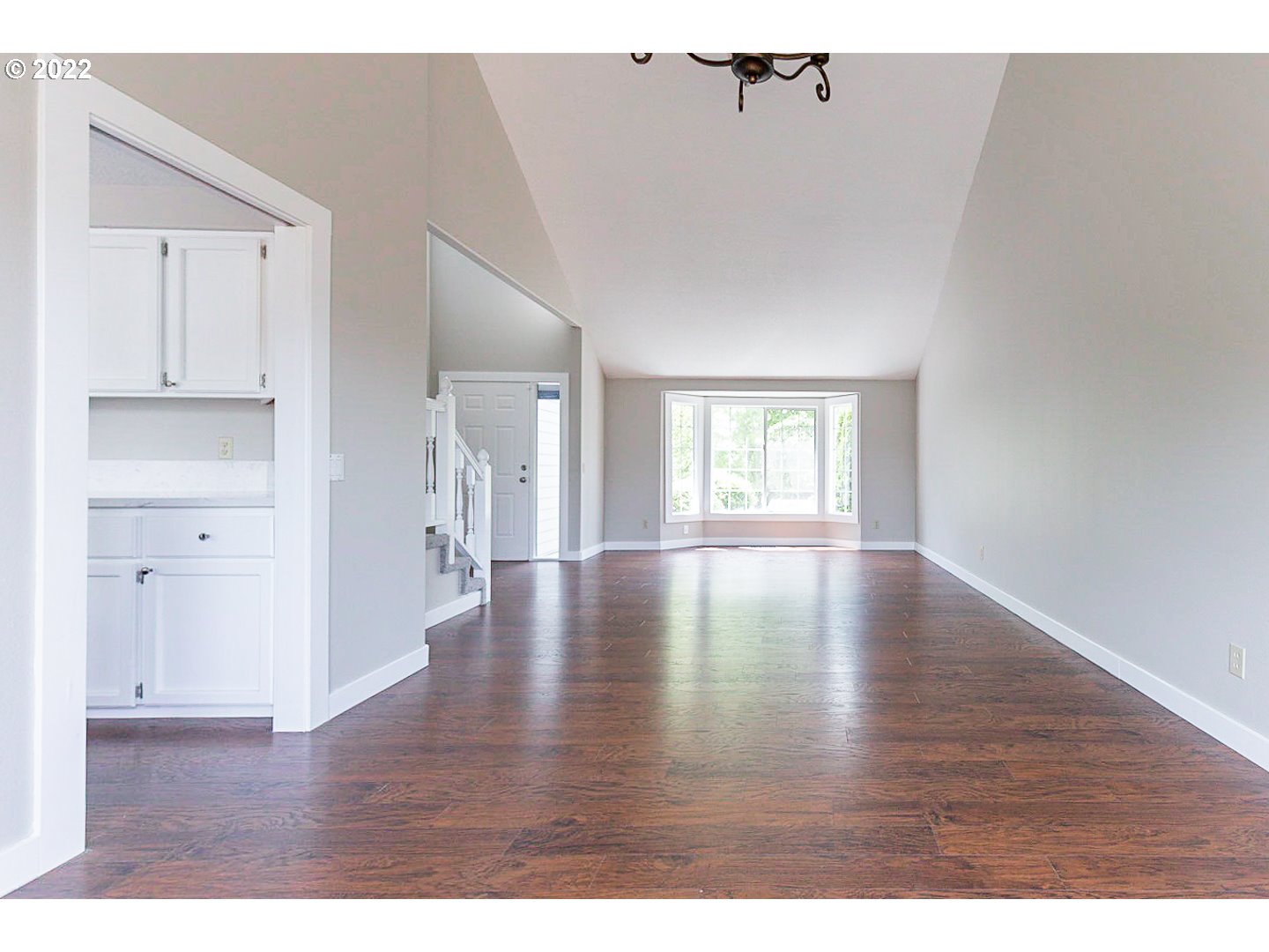 7354 Southwest 166th Terrace Beaverton, OR 97007 - Photo 14 of 32 a view of an empty room with wooden floor and a window