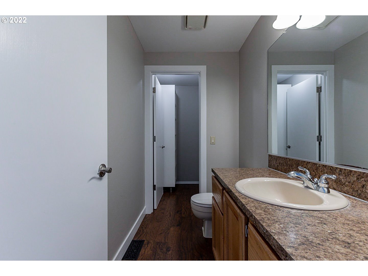7354 Southwest 166th Terrace Beaverton, OR 97007 - Photo 25 of 32 a bathroom with a granite countertop sink and a mirror