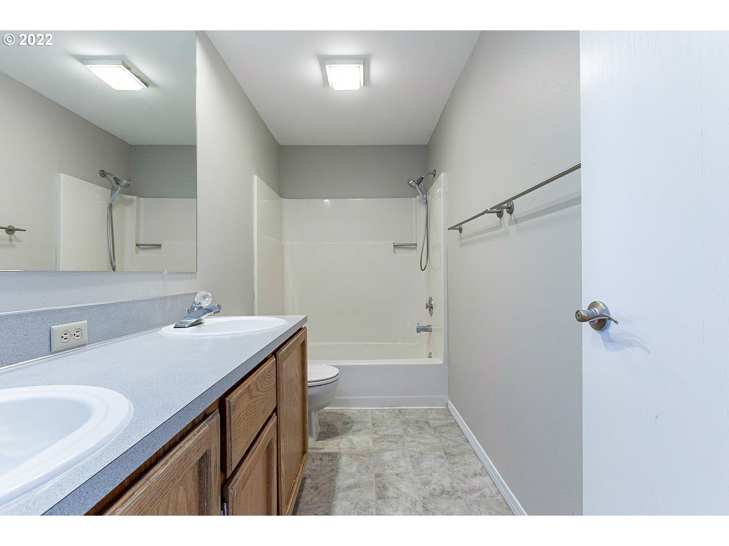 7354 Southwest 166th Terrace Beaverton, OR 97007 - Photo 4 of 32 a bathroom with a sink a mirror and a bathtub