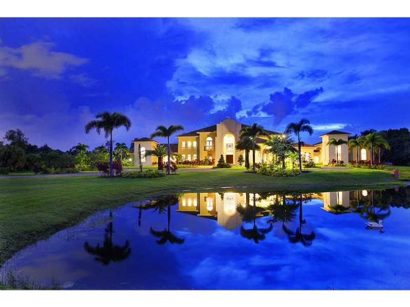 a view of an swimming pool and outdoor seating