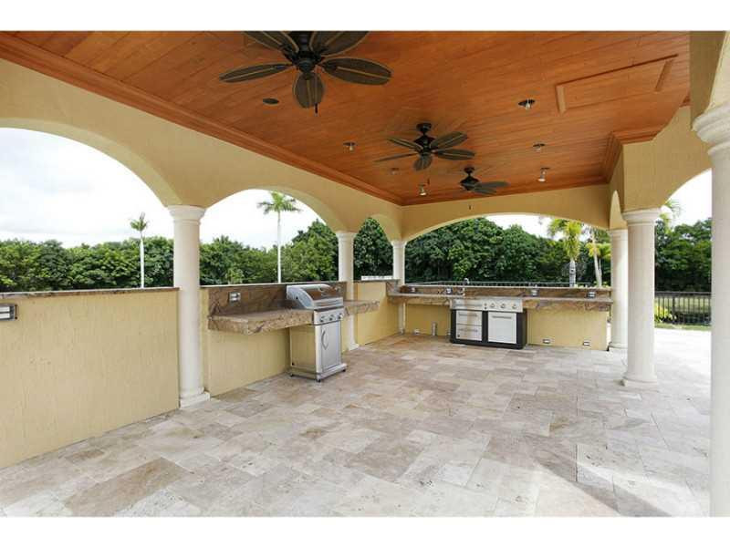 13607 Bella Ranch Lane Southwest Ranches, FL 33330 - Photo 16 of 19 a view of a swimming pool with a patio