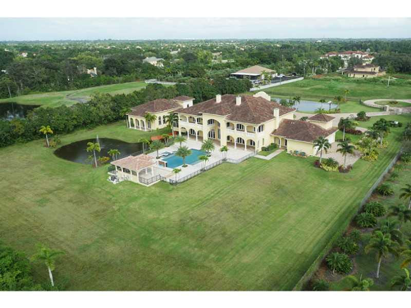 13607 Bella Ranch Lane Southwest Ranches, FL 33330 - Photo 3 of 19 a view of a lake with garden