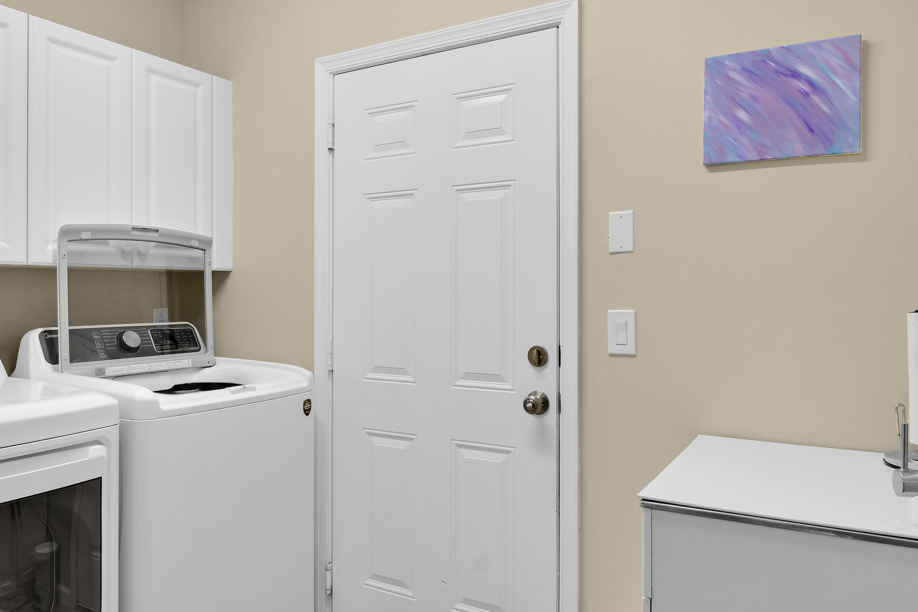 9022 Dupont Place Wellington, FL 33414 - Photo 28 of 44 Laundry room with the sink