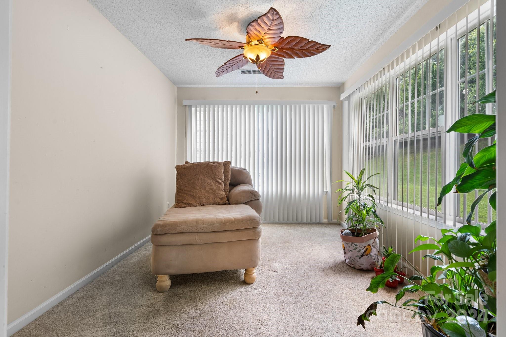 813 Raindrops Road Gastonia, NC 28054 - Photo 11 of 42 a living room with furniture and a potted plant