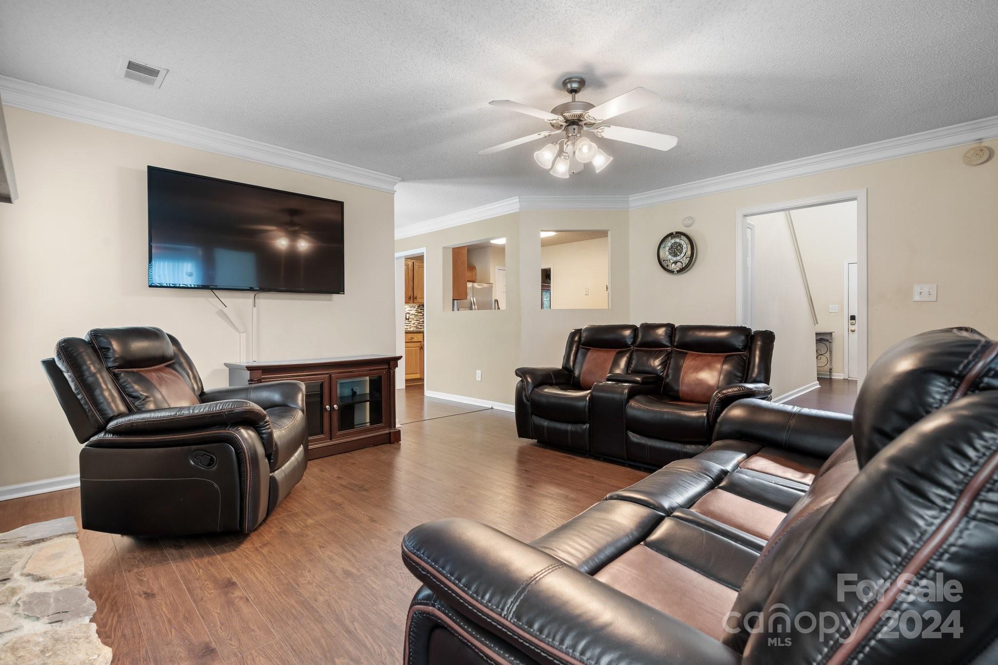 813 Raindrops Road Gastonia, NC 28054 - Photo 14 of 42 a living room with furniture and a flat screen tv