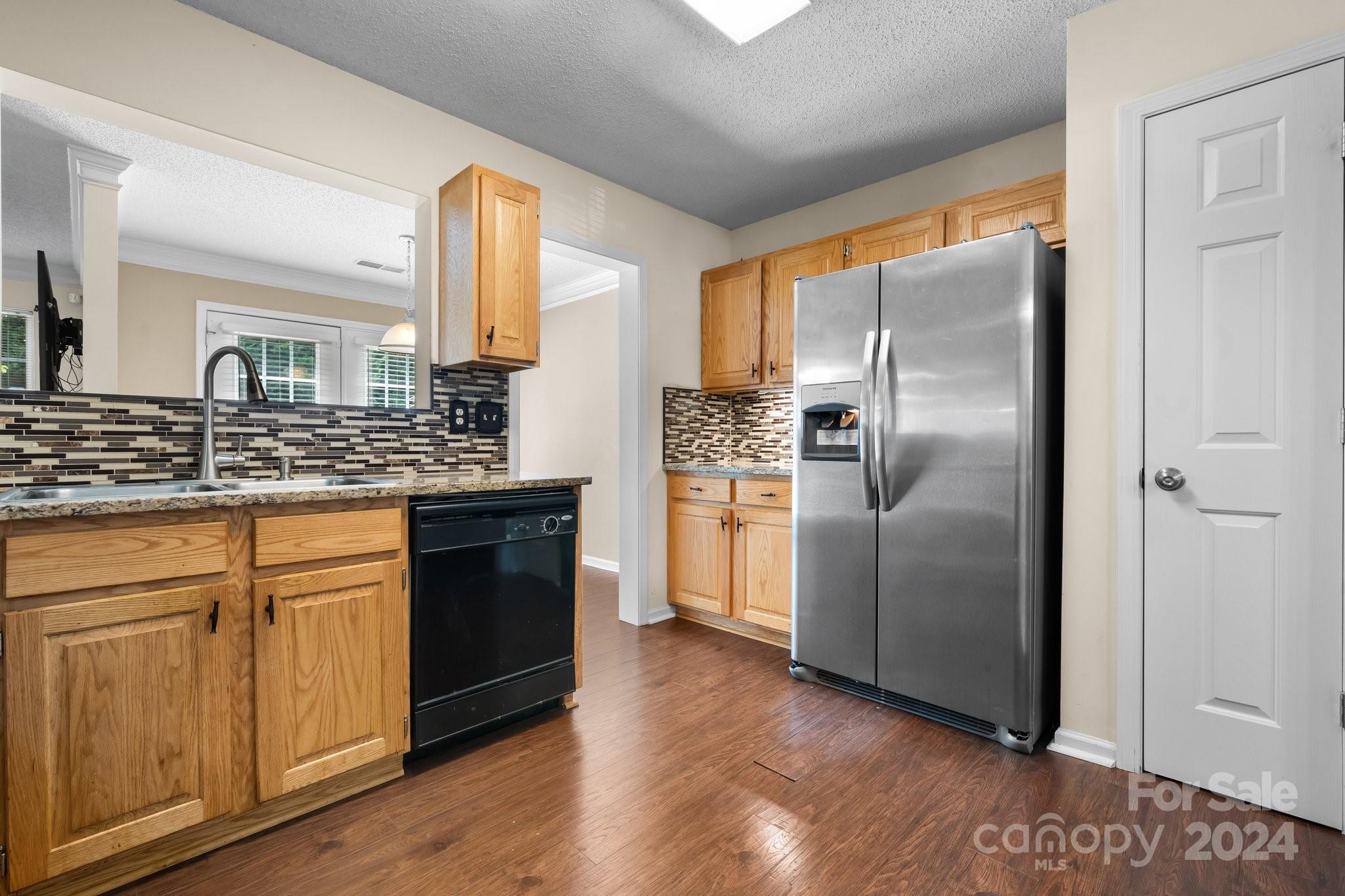 813 Raindrops Road Gastonia, NC 28054 - Photo 20 of 42 a kitchen with stainless steel appliances granite countertop a refrigerator and a stove