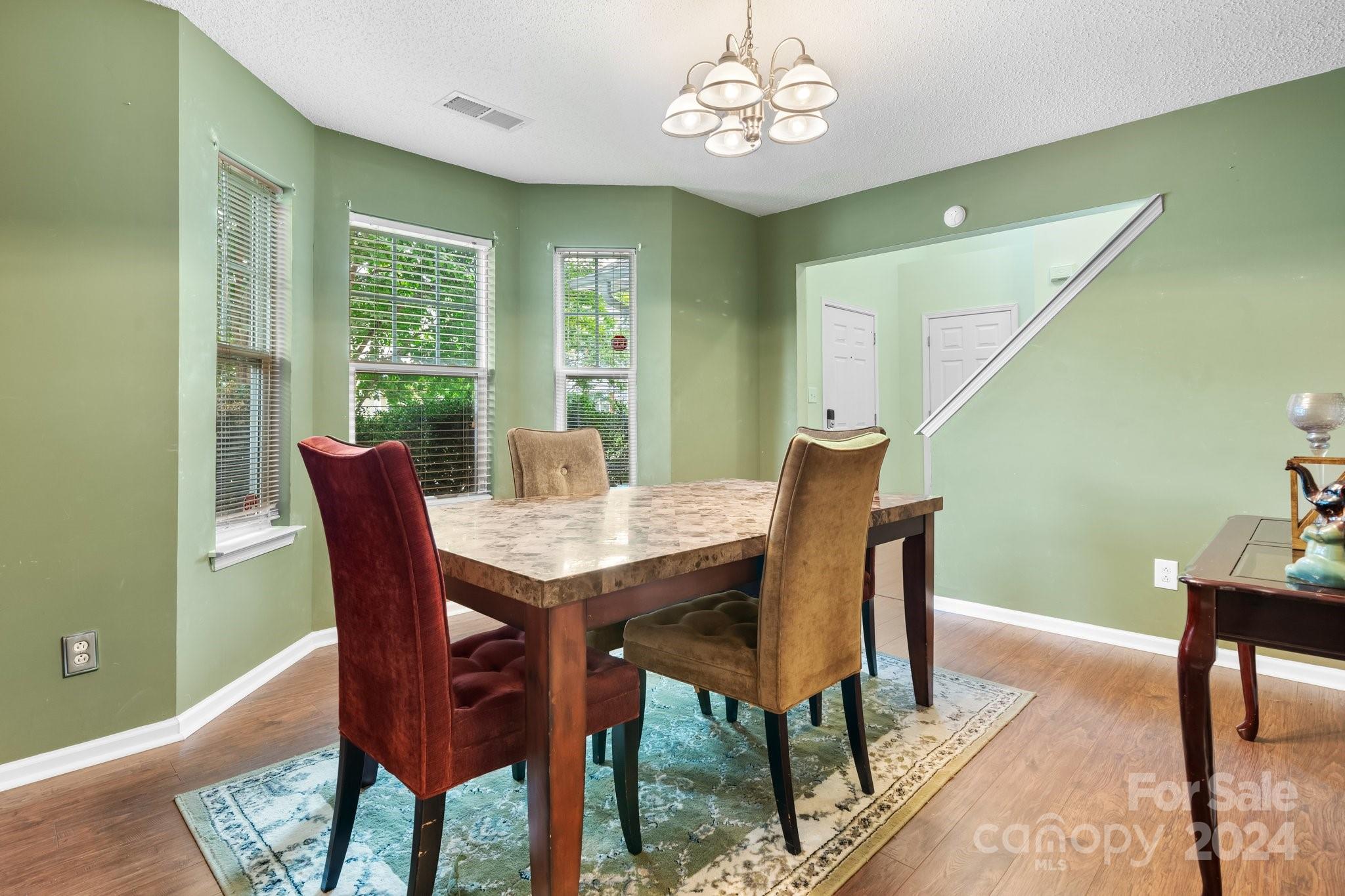 813 Raindrops Road Gastonia, NC 28054 - Photo 22 of 42 a view of a dining room with furniture window and outside view