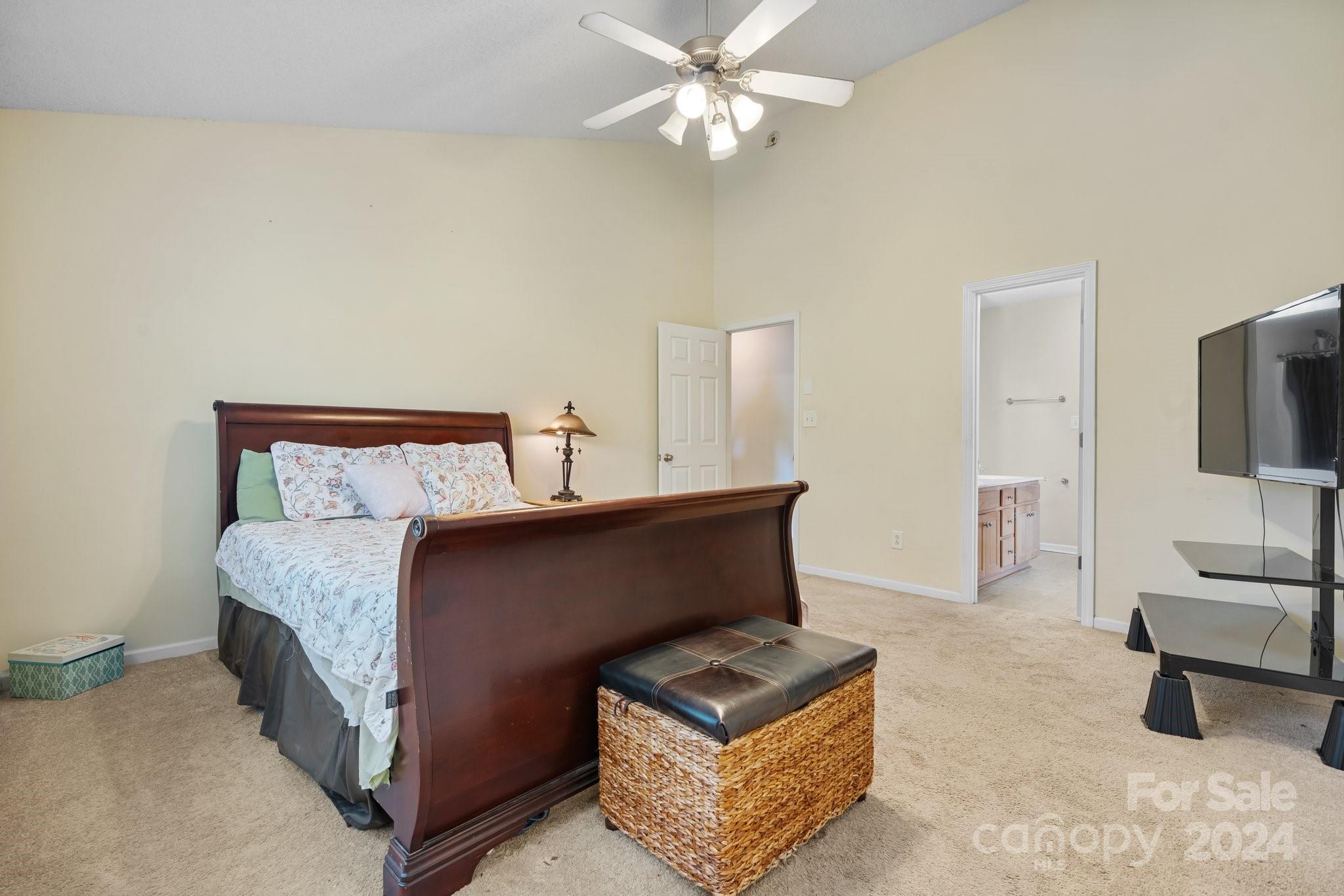 813 Raindrops Road Gastonia, NC 28054 - Photo 27 of 42 a bedroom with furniture and a flat screen tv