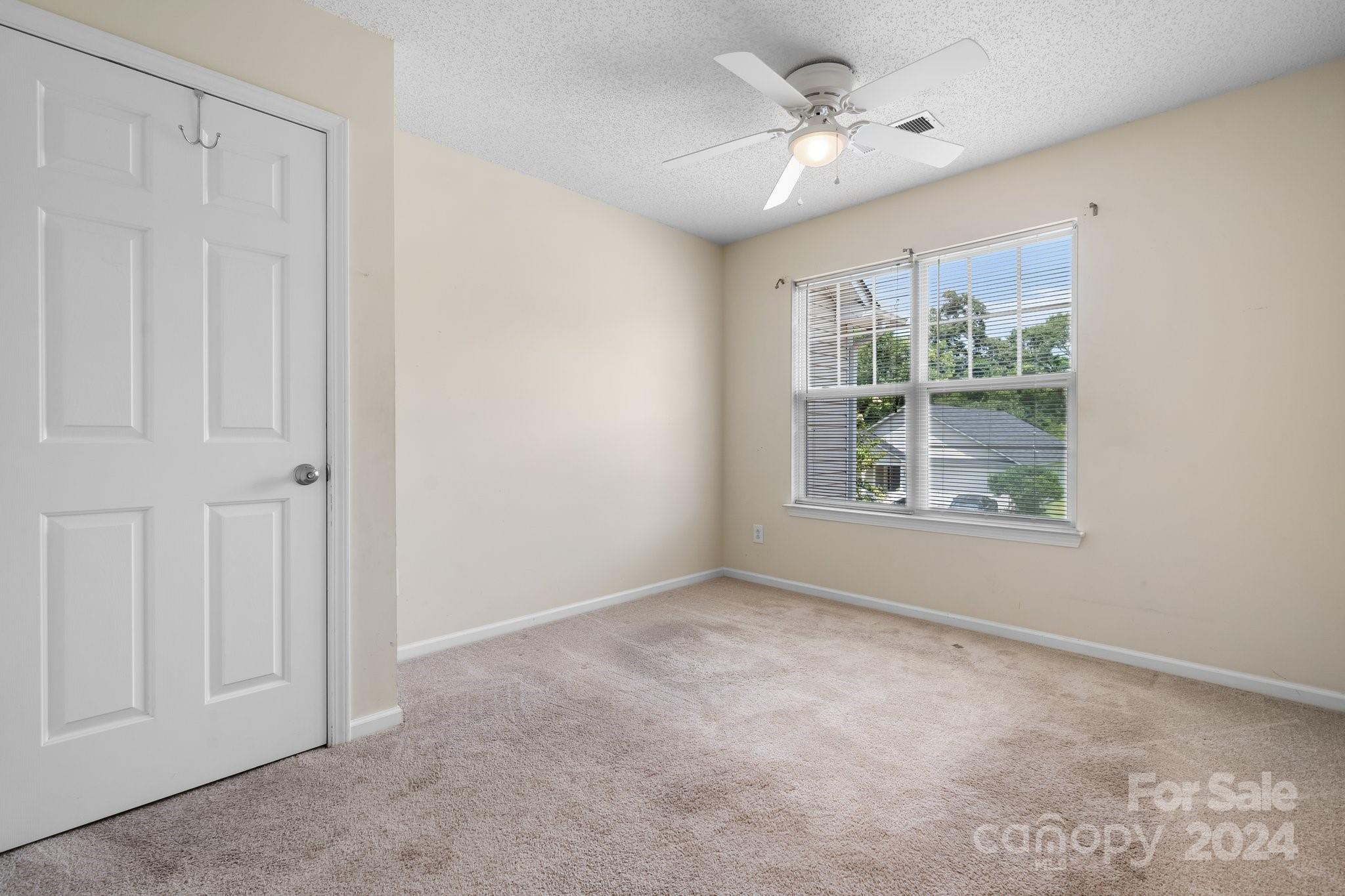 813 Raindrops Road Gastonia, NC 28054 - Photo 34 of 42 an empty room with windows and entrance