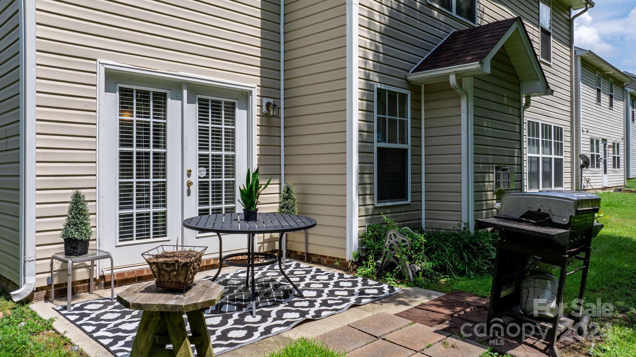 813 Raindrops Road Gastonia, NC 28054 - Photo 35 of 42 a view of a patio with two chairs and table in a patio