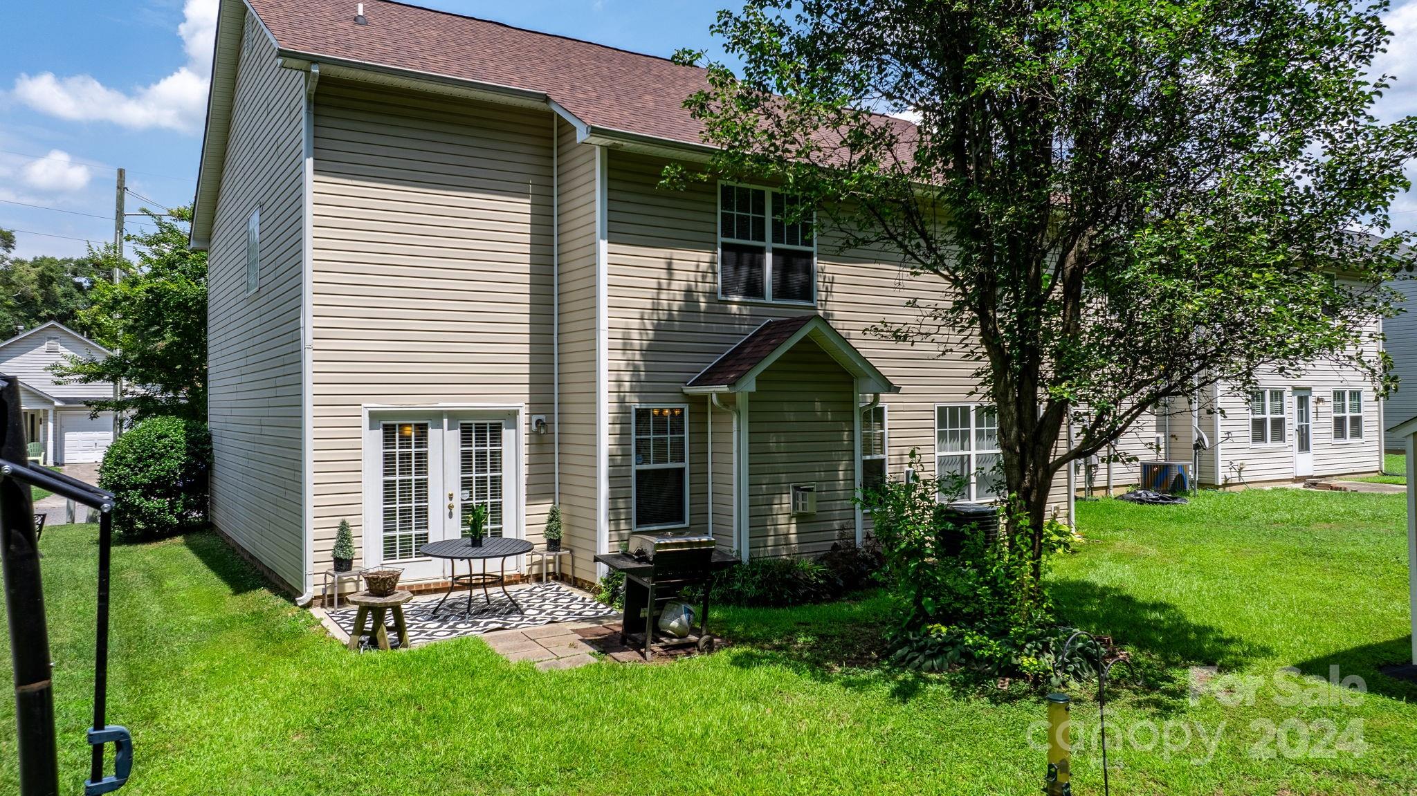 813 Raindrops Road Gastonia, NC 28054 - Photo 6 of 42 a front view of a house with a garden and porch