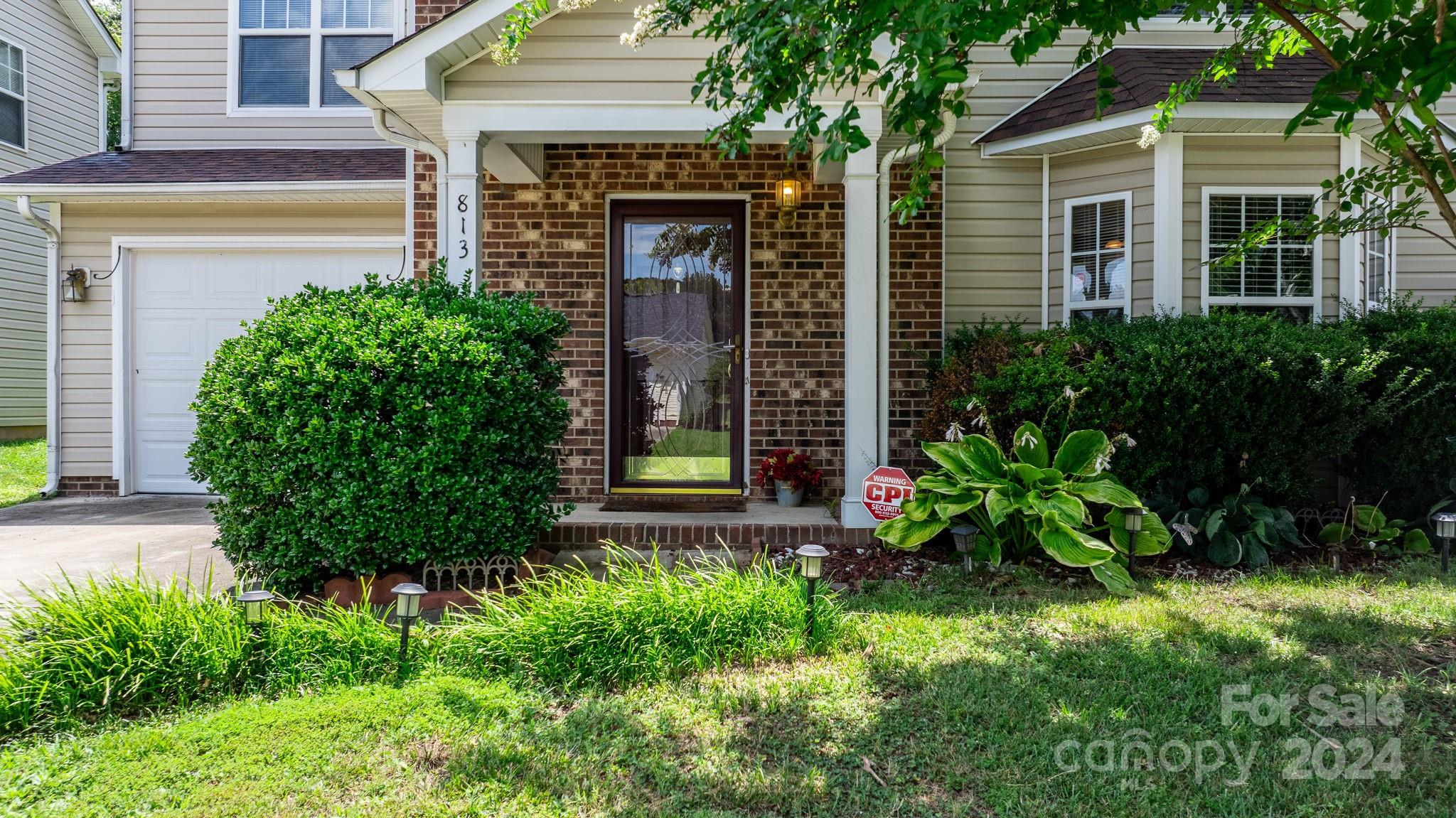 813 Raindrops Road Gastonia, NC 28054 - Photo 9 of 42 a front view of a house with a yard