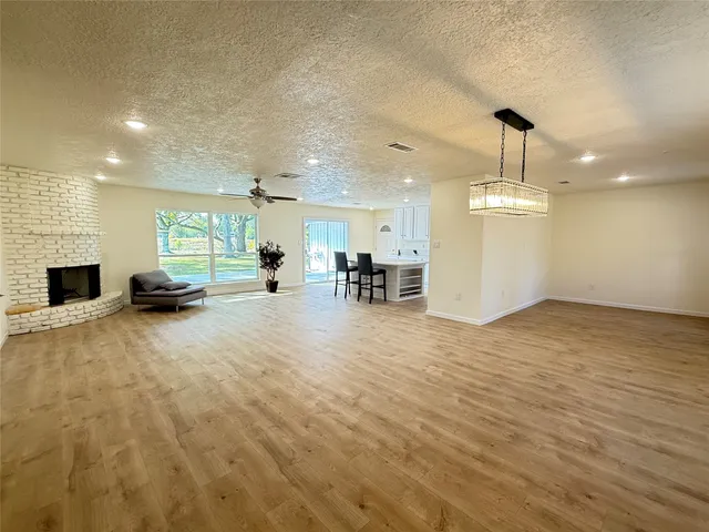 a view of a livingroom with furniture a fireplace