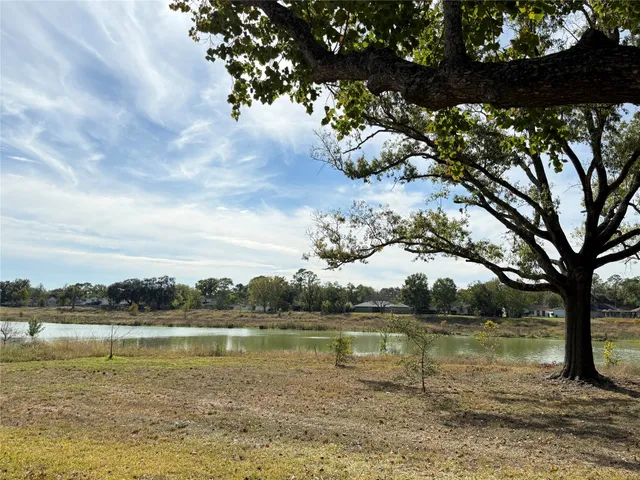 a view of lake with green space
