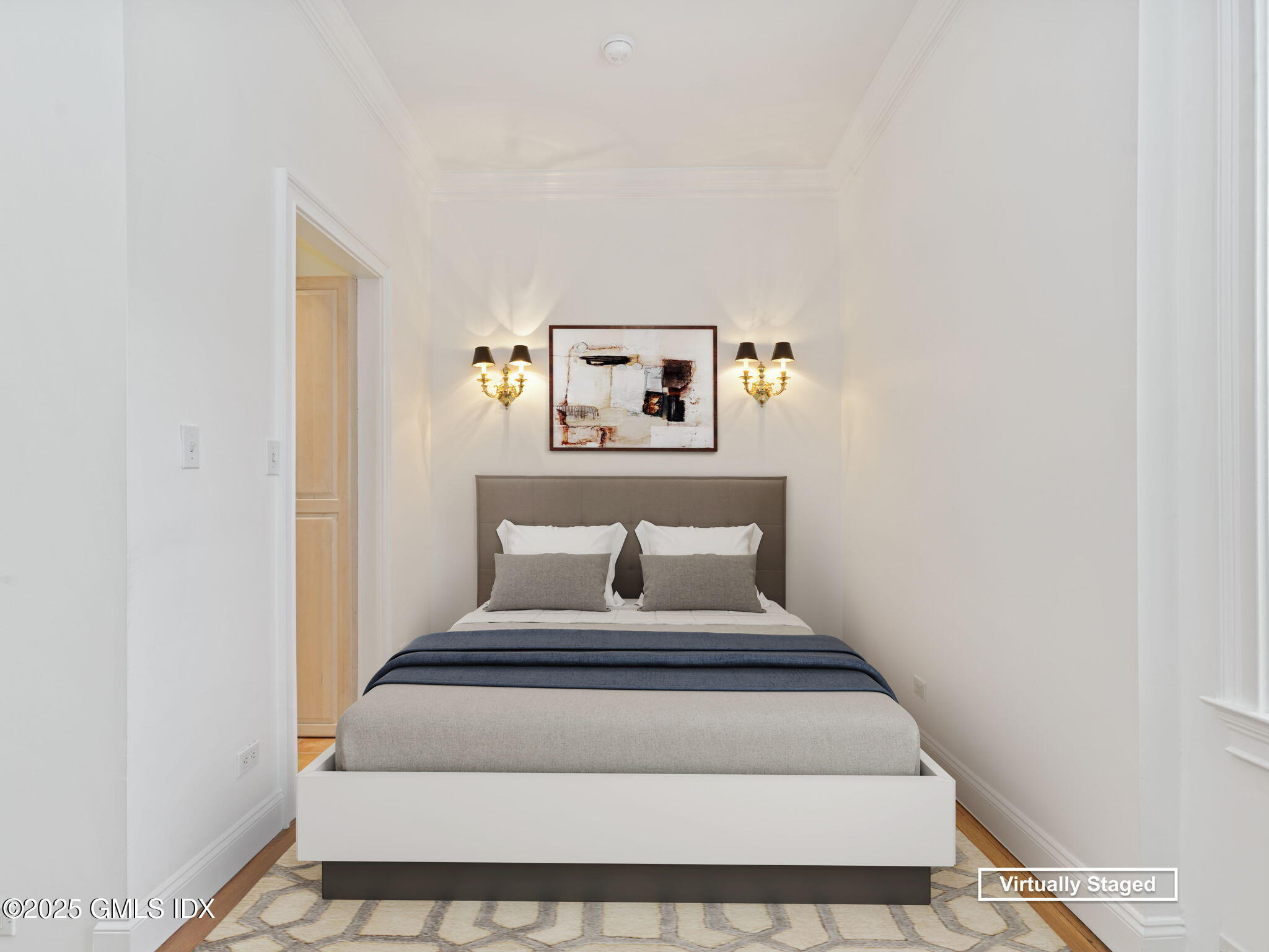 40 West Elm Street, Unit 1M Greenwich, CT 06830 - Photo 4 of 16 a bed room with a bed and painting on the wall
