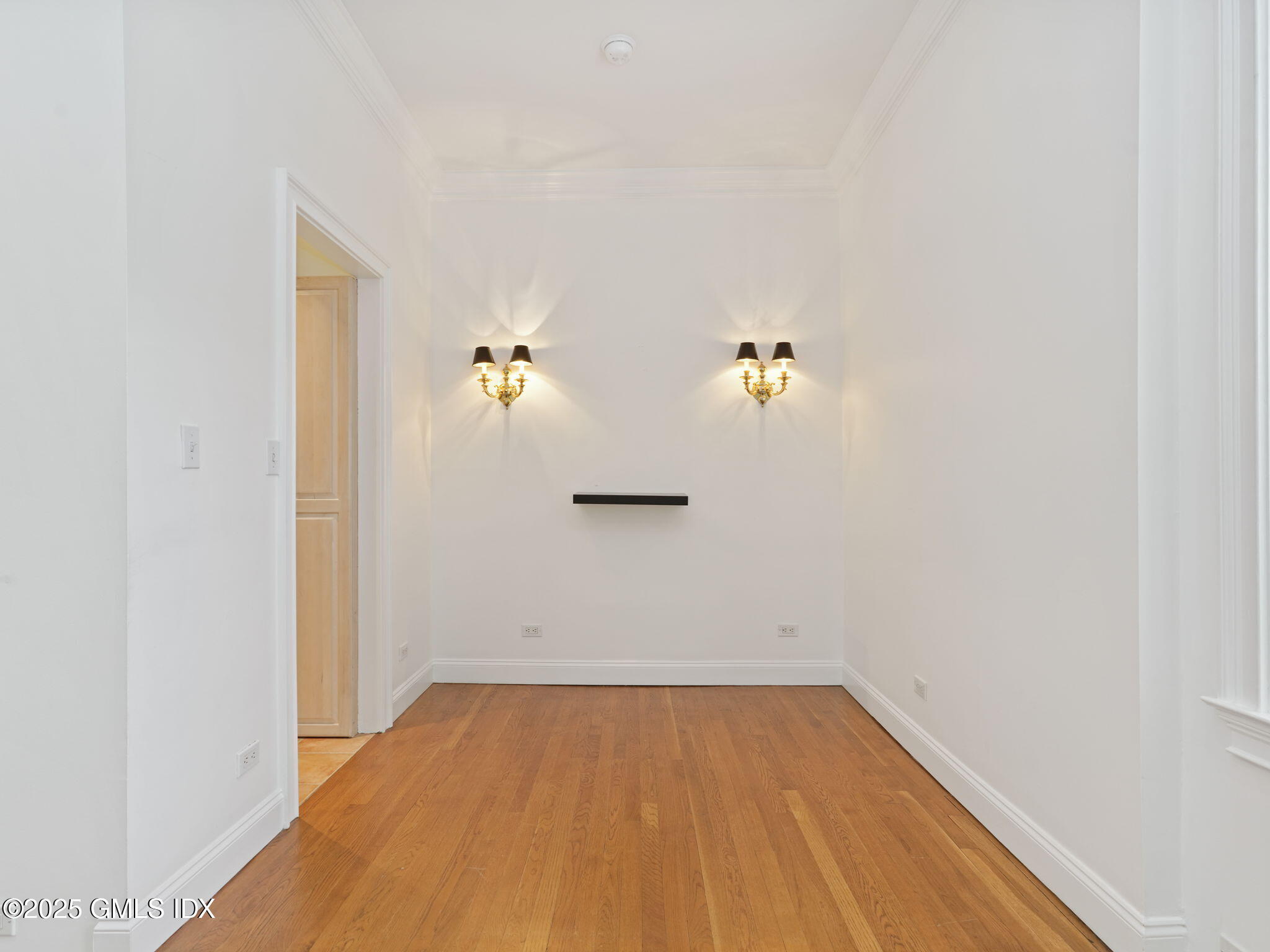 40 West Elm Street, Unit 1M Greenwich, CT 06830 - Photo 5 of 16 wooden floor in an empty room