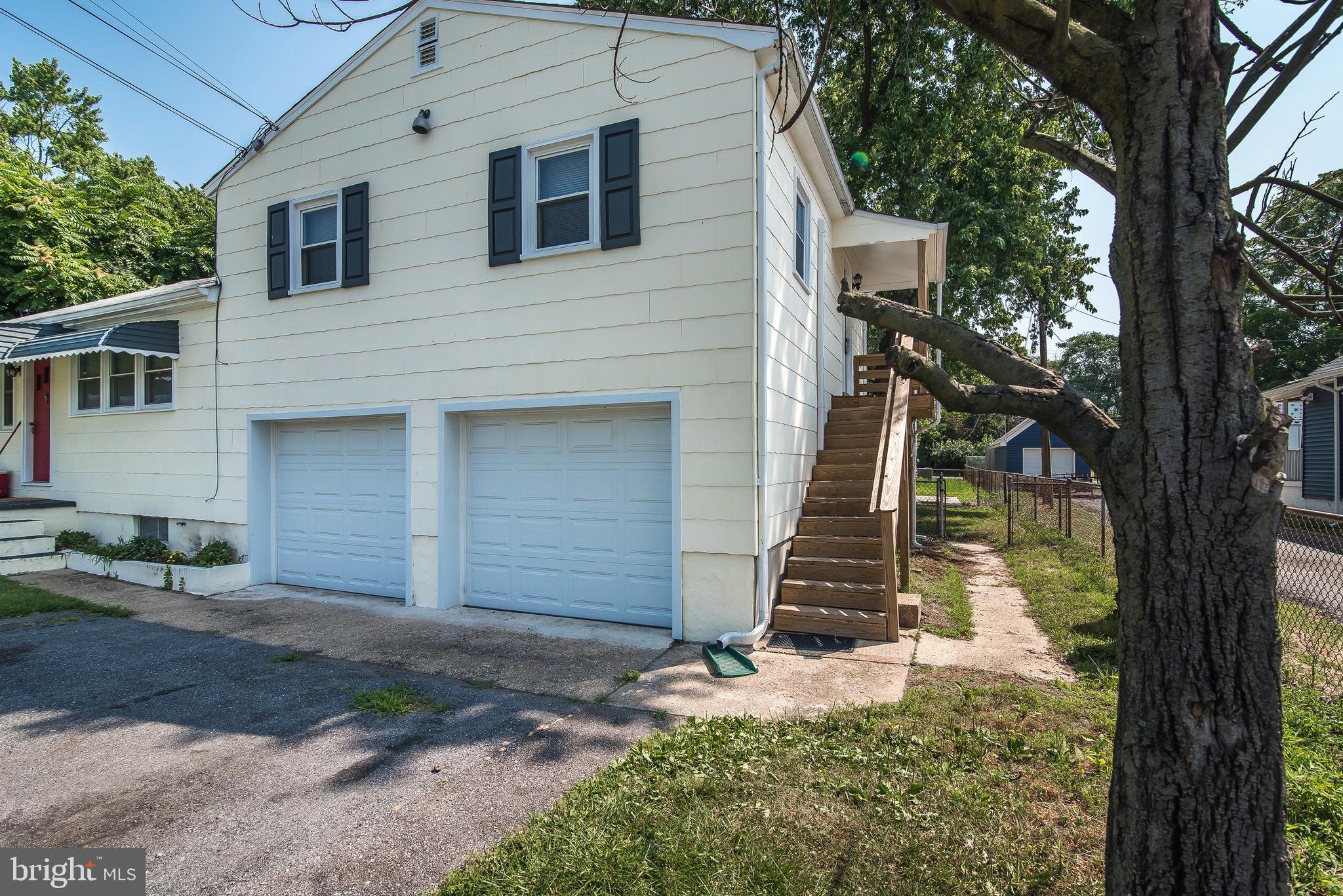 7717 Baltimore Annapolis Boulevard, Unit B Glen Burnie, MD 21060 - Photo 1 of 17 a front view of a house with a yard