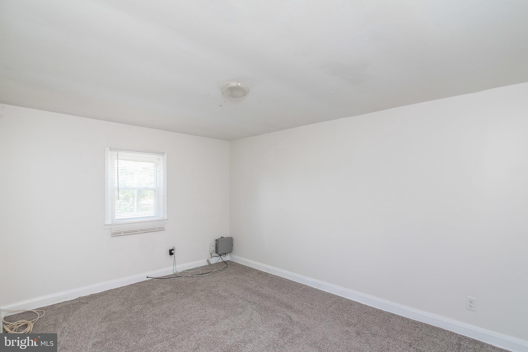 7717 Baltimore Annapolis Boulevard, Unit B Glen Burnie, MD 21060 - Photo 12 of 17 an empty room with a window