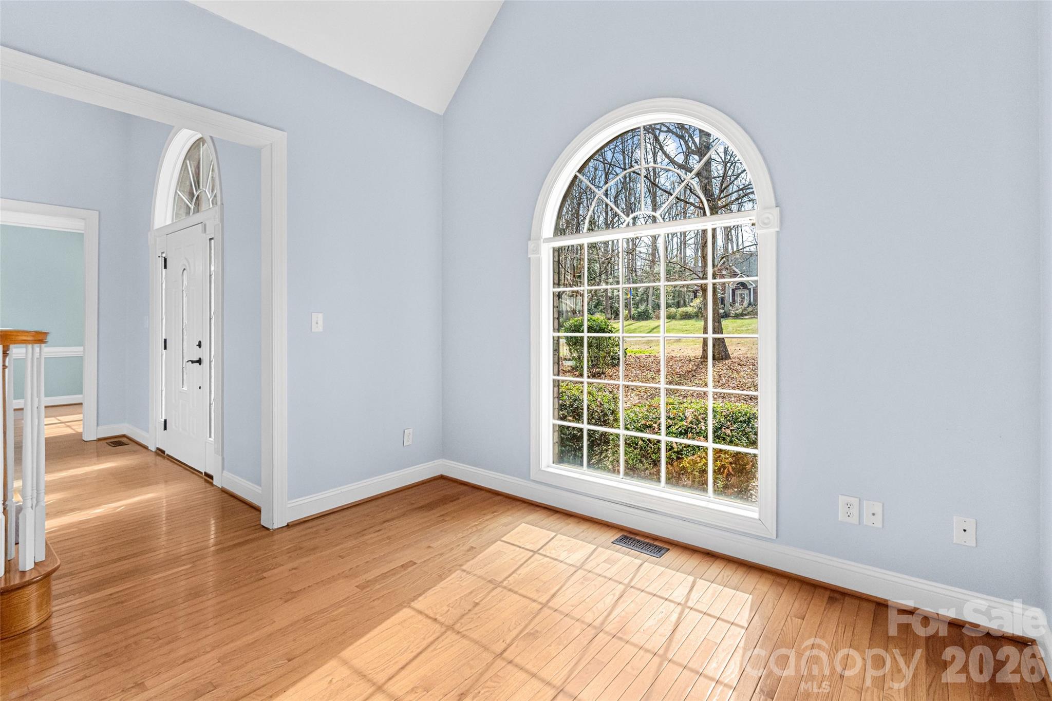 321 Forbes Court Clover, SC 29710 - Photo 17 of 31 an empty room with wooden floor windows and entrance