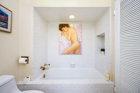 a bathroom with a bathtub and shower