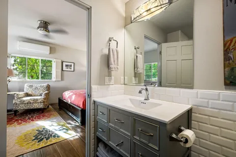 a bathroom with a sink and a mirror