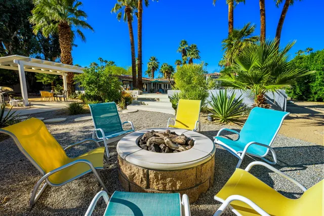a view of a swimming pool with a lounge chairs