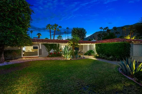 a view of a house with a garden