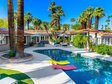 a view of a swimming pool with an outdoor seating